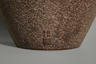 A LARGE IRON VASE WITH GEOMETRIC DECORATION