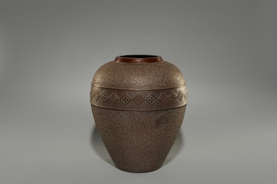 A LARGE IRON VASE WITH GEOMETRIC DECORATION
