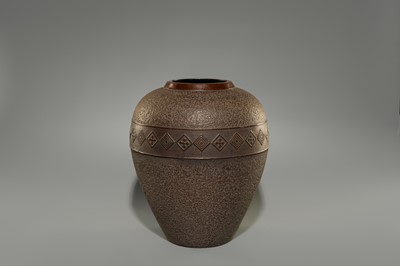 A LARGE IRON VASE WITH GEOMETRIC DECORATION