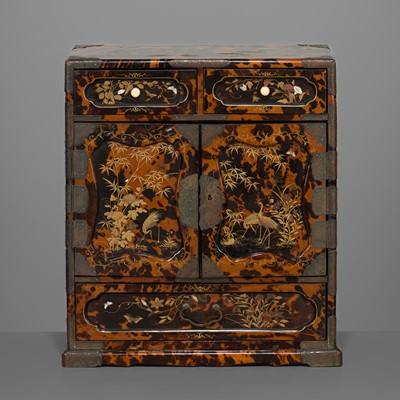 Lot 88 - AN INLAID TORTOISE SHELL LACQUER KODANSU (TABLE CABINET) DEPICTING CRANES