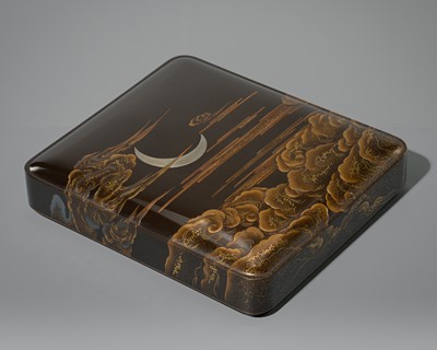 Lot 83 - A LACQUER SUZURIBAKO DEPICTING A CRESCENT MOON AMID CLOUDS