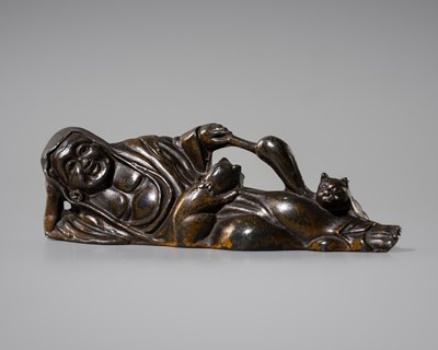 Lot 9 - A PATINATED PEWTER OKIMONO OF DARUMA WITH CATS
