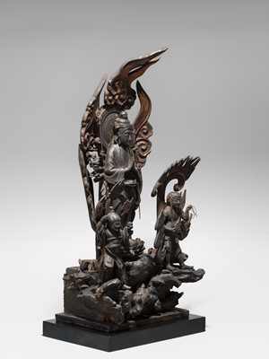 A LACQUERED WOOD FIGURE WITH A TRIAD OF KANNON BOSATSU AND ACOLYTES