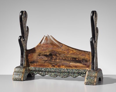 Lot 128 - A FINE MOTHER-OF-PEARL INLAID AND LACQUERED ‘MOUNT FUIJI’ KATANA KAKE (SWORD STAND)