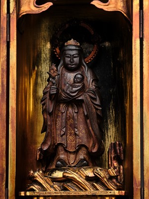 A GILT-LACQUERED WOOD ZUSHI (PORTABLE SHRINE) HOUSING KISHIMOJIN WITH HER CHILD, LATE EDO PERIOD