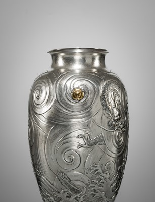 Lot 22 - KAWASHIMA TOSHU: A SUPERB AND LARGE GOLD-INLAID UCHIDASHI (REPOUSSÉ) SILVER ‘DRAGON’ VASE