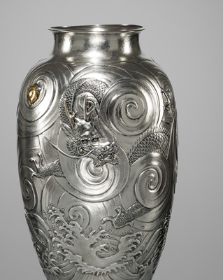 Lot 22 - KAWASHIMA TOSHU: A SUPERB AND LARGE GOLD-INLAID UCHIDASHI (REPOUSSÉ) SILVER ‘DRAGON’ VASE