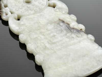 A BLACK AND WHITE JADE ‘ARCHAISTIC’ AXE-FORM OPENWORK PENDANT, 18TH CENTURY