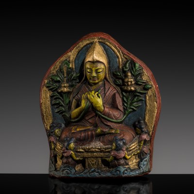 Lot 114 - A POLYCHROME FIRED CLAY TSA-TSA DEPICTING TSONGKAPA, 18TH-19TH CENTURY