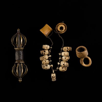 Lot 128 - A SET OF AN EIGHT-PRONGED GILT-BRONZE VAJRA, A BONE SKULL MALA AND TWO BONE BEADS, 17TH-18TH CENTURY