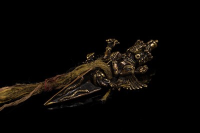 Lot 109 - A RARE PARCEL-GILT COPPER VAJRAKILA PHURBA, 17TH CENTURY