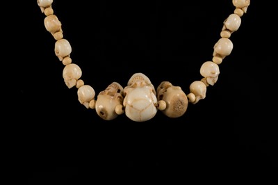 Lot 108 - AN EXCEPTIONALLY WELL CARVED BONE AND MARINE IVORY MALA WITH SKULL BEADS, SIN-‘PHEN, 18TH-19TH CENTURY