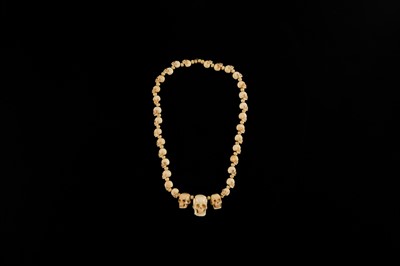 Lot 108 - AN EXCEPTIONALLY WELL CARVED BONE AND MARINE IVORY MALA WITH SKULL BEADS, SIN-‘PHEN, 18TH-19TH CENTURY