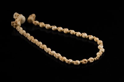 Lot 108 - AN EXCEPTIONALLY WELL CARVED BONE AND MARINE IVORY MALA WITH SKULL BEADS, SIN-‘PHEN, 18TH-19TH CENTURY