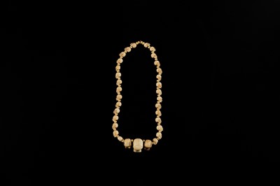 Lot 108 - AN EXCEPTIONALLY WELL CARVED BONE AND MARINE IVORY MALA WITH SKULL BEADS, SIN-‘PHEN, 18TH-19TH CENTURY
