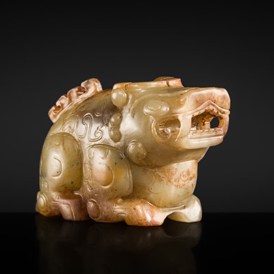 Lot 164 - AN EXCEEDINGLY RARE PALE CELADON AND RUSSET JADE FIGURE OF A MYTHICAL BOVID, PROBABLY WESTERN HAN DYNASTY