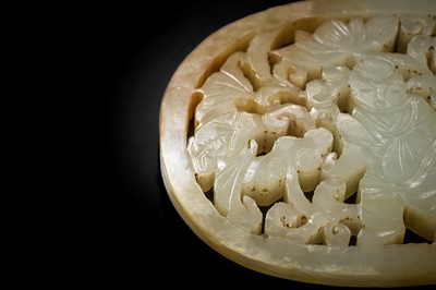 A WHITE AND RUSSET JADE PLAQUE WITH A HUMAN FIGURE AMONG FOLIAGE, LATE QING DYNASTY OR EARLIER