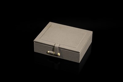 A WHITE AND RUSSET JADE PLAQUE WITH A HUMAN FIGURE AMONG FOLIAGE, LATE QING DYNASTY OR EARLIER