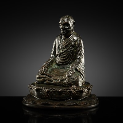 Lot 462 - A RARE BRONZE FIGURE OF A SEATED BUDDHIST MONK (BHIKSU), SUMATRA, SRIVIJAYA EMPIRE, 8TH-9TH CENTURY