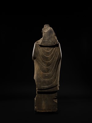 Lot 16 - A LARGE AND IMPORTANT POLISHED GRAY SCHIST FIGURE OF BUDDHA SHAKYAMUNI, ANCIENT REGION OF GANDHARA, SWAT VALLEY, 2ND-4TH CENTURY