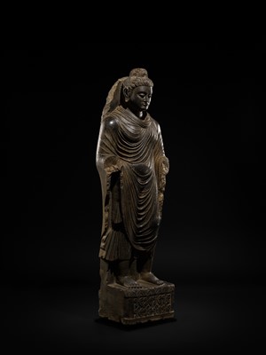 Lot 16 - A LARGE AND IMPORTANT POLISHED GRAY SCHIST FIGURE OF BUDDHA SHAKYAMUNI, ANCIENT REGION OF GANDHARA, SWAT VALLEY, 2ND-4TH CENTURY