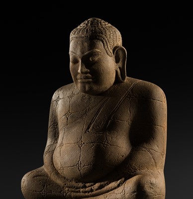 Lot 7 - AN EXCEEDINGLY RARE SANDSTONE FIGURE OF THE BUDDHIST DISCIPLE PHRA SANKACHAI, BUDAI, BAYON STYLE, ANGKOR PERIOD, LATE 12TH-13TH CENTURY