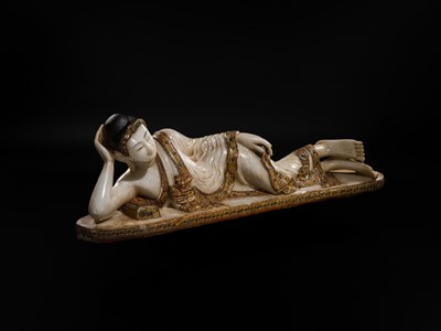 Lot 15 - A LARGE GLASS INLAID AND GILDED ALABASTER FIGURE OF THE RECLINING BUDDHA, MANDALAY PERIOD, 19TH CENTURY