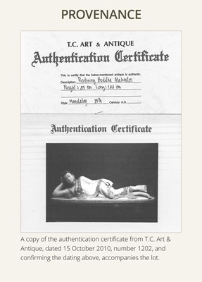 Lot 15 - A LARGE GLASS INLAID AND GILDED ALABASTER FIGURE OF THE RECLINING BUDDHA, MANDALAY PERIOD, 19TH CENTURY