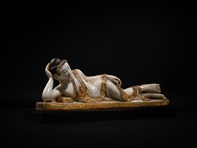 Lot 15 - A LARGE GLASS INLAID AND GILDED ALABASTER FIGURE OF THE RECLINING BUDDHA, MANDALAY PERIOD, 19TH CENTURY