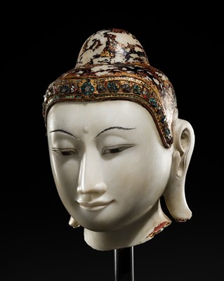 Lot 13 - A GILT-LACQUERED AND GLASS INLAID WHITE ALABASTER HEAD OF BUDDHA, MANDALAY, 18TH-19TH CENTURY