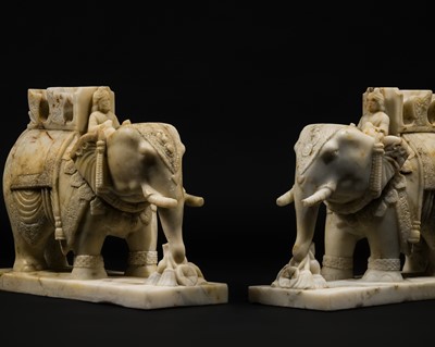 Lot 23 - A PAIR OF FINELY CARVED WHITE MARBLE ELEPHANTS, RAJASTHAN