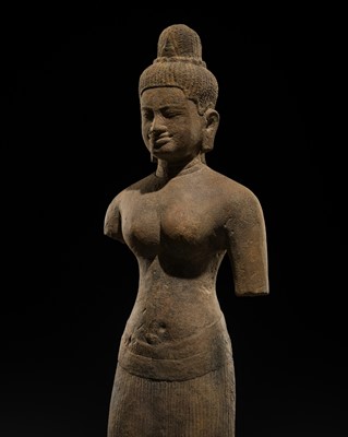Lot 3 - A SANDSTONE FIGURE OF A FEMALE DEITY, BAPHUON STYLE, ANGKOR PERIOD