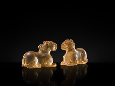 Lot 31 - AN EXCEPTIONALLY WELL CARVED PAIR OF ROCK CRYSTAL FELINE FIGURES, HAN DYNASTY
