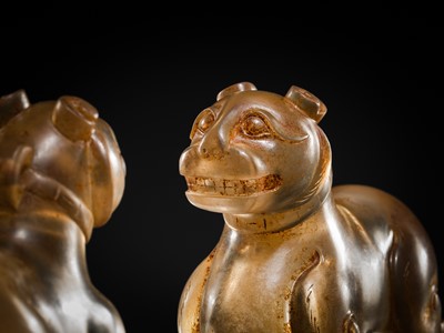 Lot 31 - AN EXCEPTIONALLY WELL CARVED PAIR OF ROCK CRYSTAL FELINE FIGURES, HAN DYNASTY