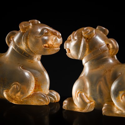 Lot 31 - AN EXCEPTIONALLY WELL CARVED PAIR OF ROCK CRYSTAL FELINE FIGURES, HAN DYNASTY