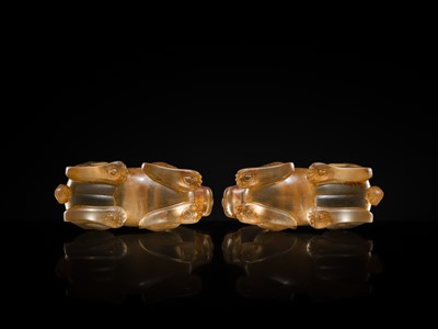 Lot 31 - AN EXCEPTIONALLY WELL CARVED PAIR OF ROCK CRYSTAL FELINE FIGURES, HAN DYNASTY