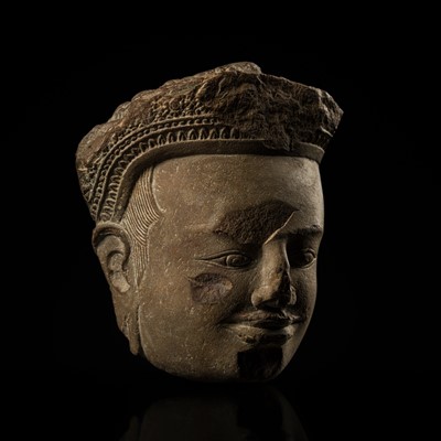 Lot 1 - A SANDSTONE HEAD OF A DEITY, ANGKOR PERIOD, 11TH CENTURY
