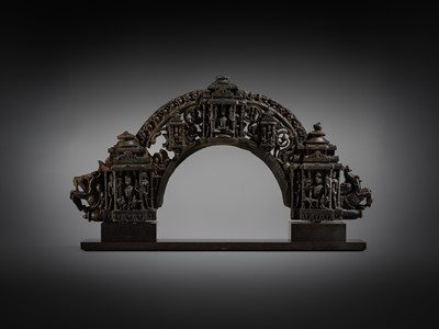 Lot 18 - A BLACK STONE ARCH FROM THE PRABHATORANA OF A VISHNU STELE, GAHADAVALA DYNASTY, INDIA, 11TH-12TH CENTURY