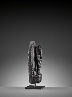 Lot 450 - A SINO-TIBETAN BLACK STONE FIGURE OF PANJARANATA MAHAKALA, 17TH CENTURY