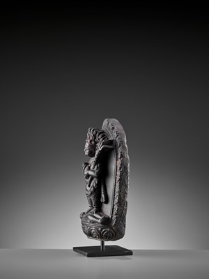 Lot 450 - A SINO-TIBETAN BLACK STONE FIGURE OF PANJARANATA MAHAKALA, 17TH CENTURY