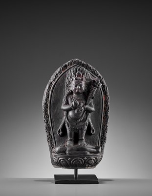 Lot 450 - A SINO-TIBETAN BLACK STONE FIGURE OF PANJARANATA MAHAKALA, 17TH CENTURY