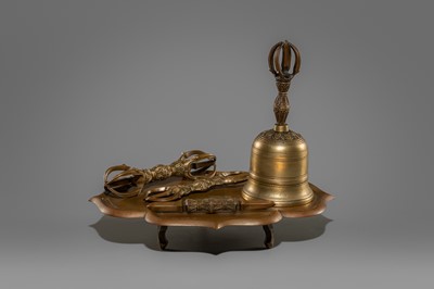 A SET COMPRISING A BRONZE KONGOBAN (RITUAL TRAY), A BELL AND THREE VAJRA