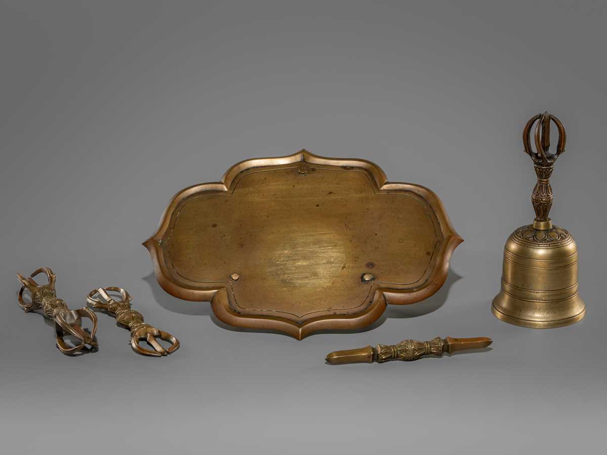 A SET COMPRISING A BRONZE KONGOBAN (RITUAL TRAY), A BELL AND THREE VAJRA