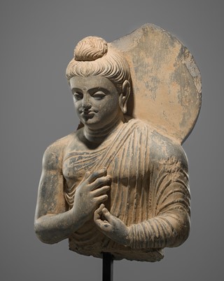 A GREY SCHIST BUST OF BUDDHA, GANDHARA STYLE
