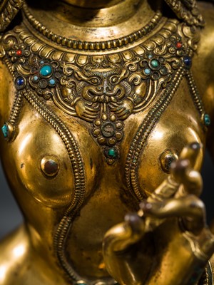 Lot 20 - A VERY LARGE AND EXCEPTIONALLY RARE GILT-BRONZE FIGURE OF GREEN TARA, TIBET, CIRCA 16TH-18TH CENTURY