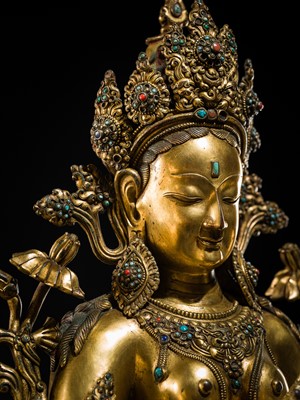 Lot 20 - A VERY LARGE AND EXCEPTIONALLY RARE GILT-BRONZE FIGURE OF GREEN TARA, TIBET, CIRCA 16TH-18TH CENTURY