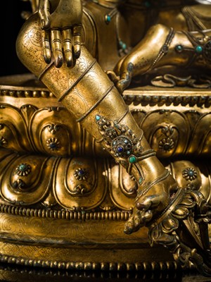 Lot 20 - A VERY LARGE AND EXCEPTIONALLY RARE GILT-BRONZE FIGURE OF GREEN TARA, TIBET, CIRCA 16TH-18TH CENTURY
