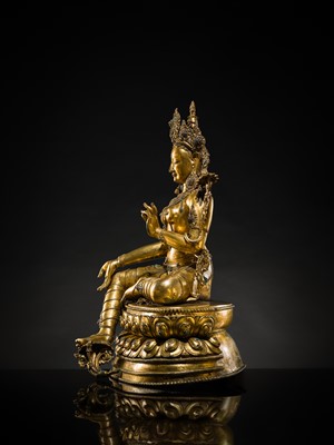Lot 20 - A VERY LARGE AND EXCEPTIONALLY RARE GILT-BRONZE FIGURE OF GREEN TARA, TIBET, CIRCA 16TH-18TH CENTURY