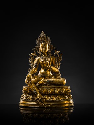 Lot 20 - A VERY LARGE AND EXCEPTIONALLY RARE GILT-BRONZE FIGURE OF GREEN TARA, TIBET, CIRCA 16TH-18TH CENTURY