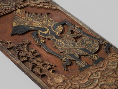 Lot 519 - A RARE POLYCHROME WOOD ‘WAYANG’ BLAWONG (KRIS DISPLAY BOARD) DEPICTING ARJUNA, JAVA